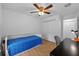 Bright bedroom featuring a built-in bed, ceiling fan, and closet with an adjacent desk at 905 W Fribley St, Tampa, FL 33603