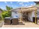 Charming outdoor patio with tiki bar, stylish seating, and decorative accents for relaxation and fun at 905 W Fribley St, Tampa, FL 33603