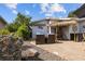 Cozy outdoor patio with comfortable seating, tiki bar, and stone accents, perfect for entertaining at 905 W Fribley St, Tampa, FL 33603