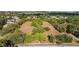 Birds-eye view of green space with mature trees and a walking path located in a neighborhood at 905 W Fribley St, Tampa, FL 33603