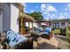 Outdoor patio featuring stylish furniture, fire pit, tiki bar, and tropical landscape at 905 W Fribley St, Tampa, FL 33603