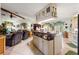 Open kitchen with a breakfast bar island, adjacent to a cozy living room area at 9202 Jena Rd, Spring Hill, FL 34608