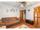 Comfortable living room featuring a neutral-toned sofa, and warm wood accents at 9202 Jena Rd, Spring Hill, FL 34608