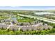 Aerial view of the community near a highway and lake surrounded by lush greenery at 9519 Newdale Way # 202, Riverview, FL 33578