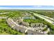 Aerial view of community near a highway, lake, surrounded by lush greenery with location pin at 9519 Newdale Way # 202, Riverview, FL 33578