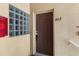 Apartment door with the number 202 next to a glass brick window at 9519 Newdale Way # 202, Riverview, FL 33578