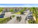 Gated community entrance with landscaped island, parking, and attractive two-story residential buildings in the background at 9519 Newdale Way # 202, Riverview, FL 33578