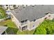Aerial view of an apartment building with a gray roof and a screened-in patio at 9519 Newdale Way # 202, Riverview, FL 33578