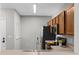 Cozy kitchen featuring wood cabinets, black appliances, and a stainless steel sink at 9519 Newdale Way # 202, Riverview, FL 33578