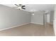 Bright living room with tile flooring, ceiling fan, and neutral paint at 9519 Newdale Way # 202, Riverview, FL 33578