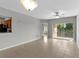 Open living area featuring tile floors, natural light, and view into the kitchen at 9519 Newdale Way # 202, Riverview, FL 33578