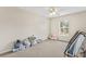 Bright bedroom with a window, plush carpet, and ample space for customization at 10311 Frog Pond Dr, Riverview, FL 33569