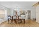 Dining room with hardwood floors, stylish lighting, and elegant decor, perfect for entertaining at 10311 Frog Pond Dr, Riverview, FL 33569