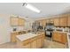 Well-lit kitchen boasts modern appliances, island sink, and ample counter space at 10311 Frog Pond Dr, Riverview, FL 33569