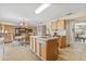Spacious eat in kitchen features tiled flooring and a view into the dining and living areas at 10311 Frog Pond Dr, Riverview, FL 33569