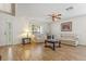 Bright living room with wood flooring, neutral paint, and two sofas with decorative pillows at 10311 Frog Pond Dr, Riverview, FL 33569