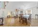 Bright and airy living room with hardwood floors, comfortable seating, and abundant natural light at 10311 Frog Pond Dr, Riverview, FL 33569