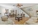 Open concept living and dining area features beautiful wood floors and neutral walls at 10311 Frog Pond Dr, Riverview, FL 33569