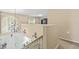 Loft overlooking the entry with chandelier and stairway to the main floor at 10311 Frog Pond Dr, Riverview, FL 33569