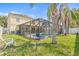 Backyard view of a screened-in pool and well maintained backyard with plenty of room for entertainment at 10311 Frog Pond Dr, Riverview, FL 33569