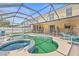 Backyard screened-in pool and spa, ideal for entertaining and relaxing in privacy at 10311 Frog Pond Dr, Riverview, FL 33569