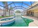 Screened-in pool and spa area perfect for relaxation and outdoor enjoyment at 10311 Frog Pond Dr, Riverview, FL 33569