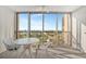 Balcony featuring a table and chairs offers a relaxing outdoor space at 10355 Paradise Blvd # 502, Treasure Island, FL 33706