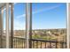 Enjoy panoramic views from this condo's balcony, featuring clear skies and lush landscaping at 10355 Paradise Blvd # 502, Treasure Island, FL 33706