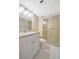 A bathroom with a shower and vanity at 10355 Paradise Blvd # 502, Treasure Island, FL 33706