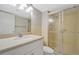 Bathroom with a shower stall and a vanity at 10355 Paradise Blvd # 502, Treasure Island, FL 33706