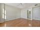 Inviting bedroom features hardwood floors, a ceiling fan, and an ensuite bathroom for convenience at 10355 Paradise Blvd # 502, Treasure Island, FL 33706