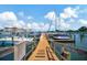 Waterfront dock with boats and condos at 10355 Paradise Blvd # 502, Treasure Island, FL 33706