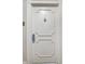 Close-up of a white apartment door with a decorative knocker and a 'Do Not Disturb' sign at 10355 Paradise Blvd # 502, Treasure Island, FL 33706