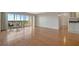 Bright living room with hardwood floors and sliding glass doors leading to a balcony with a view at 10355 Paradise Blvd # 502, Treasure Island, FL 33706
