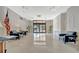 The lobby with neutral walls and tile and blue sofas at 10355 Paradise Blvd # 502, Treasure Island, FL 33706