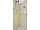 Shower stall with tan and neutral tile at 10355 Paradise Blvd # 502, Treasure Island, FL 33706