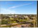 Scenic view showcasing cityscapes, palm trees, and blue waters from a high-rise at 10355 Paradise Blvd # 502, Treasure Island, FL 33706