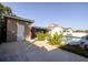 Backyard pool with outdoor storage, lush landscaping, and ample patio space at 10733 Drummond Rd, Tampa, FL 33615