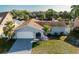 Aerial view showcasing the home's front elevation and curb appeal at 10733 Drummond Rd, Tampa, FL 33615