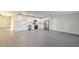 Open-concept kitchen featuring stainless appliances, new cabinets, and stone countertops with lots of room at 10733 Drummond Rd, Tampa, FL 33615