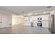 Modern kitchen with new stainless appliances, stone countertops, and lots of cabinet space at 10733 Drummond Rd, Tampa, FL 33615