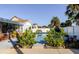 Backyard pool and patio featuring lush landscaping and a privacy fence at 10733 Drummond Rd, Tampa, FL 33615