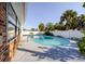 Backyard pool featuring ample seating space and a privacy fence at 10733 Drummond Rd, Tampa, FL 33615