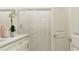 Bathroom with white subway tile shower, glass enclosure, and double vanity with stone countertop at 10873 Rustic Eve Ct, Land O Lakes, FL 34638