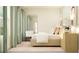 Cozy bedroom with neutral tones, modern furnishings, and soft, natural light at 10873 Rustic Eve Ct, Land O Lakes, FL 34638