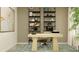Home office with desk, stylish shelving, comfortable chair, and plenty of natural light at 10873 Rustic Eve Ct, Land O Lakes, FL 34638