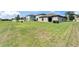 A spacious backyard with lush green grass and a well-maintained lawn at 11121 Hudson Hills Ln, Riverview, FL 33579