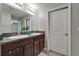 Bright bathroom featuring dual sinks, granite countertops, and a shower with curtain at 11121 Hudson Hills Ln, Riverview, FL 33579