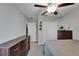 Bedroom featuring gray carpet, wood furniture and a ceiling fan at 11121 Hudson Hills Ln, Riverview, FL 33579