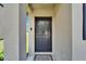 Inviting front door with welcome mat and charming exterior, perfect for a warm greeting at 11121 Hudson Hills Ln, Riverview, FL 33579
